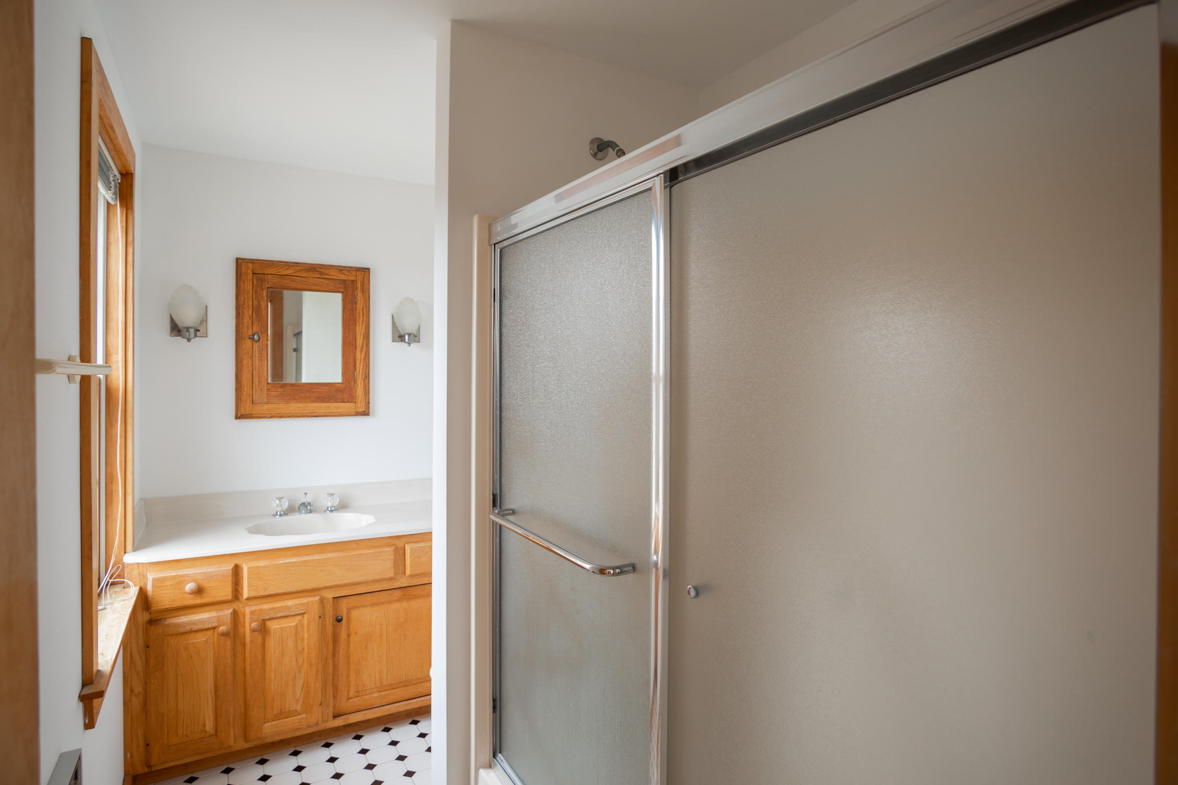 35 Bayberry Lane Eastham, MA 02642 - Photo 31 of 42 a bathroom with a granite countertop sink and a shower