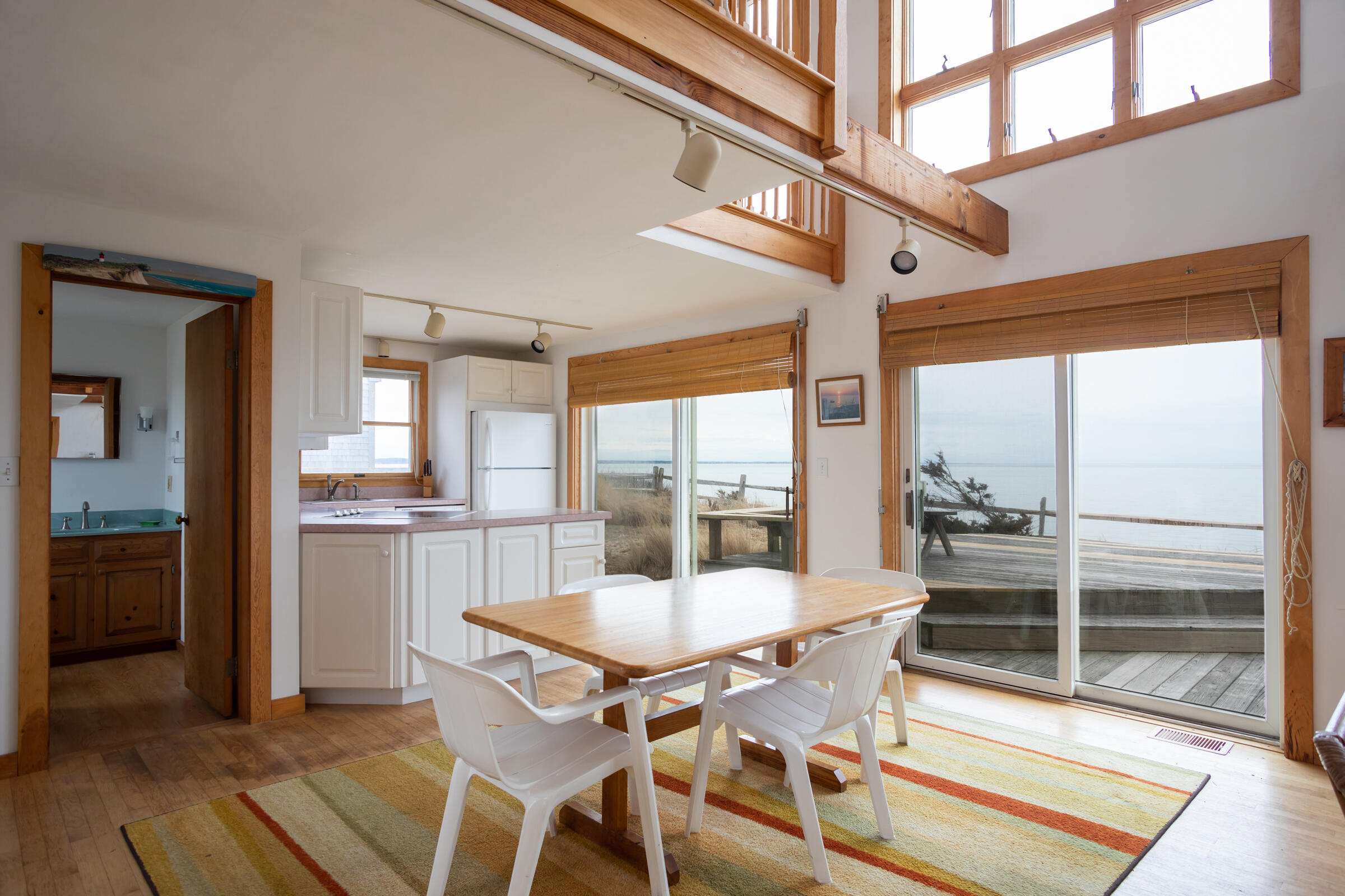 35 Bayberry Lane Eastham, MA 02642 - Photo 10 of 42 a dining room with furniture and a floor to ceiling window