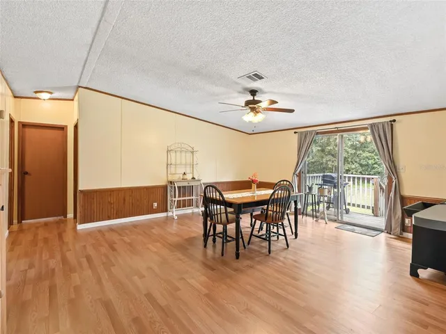 a view of a livingroom with furniture window and wooden floor