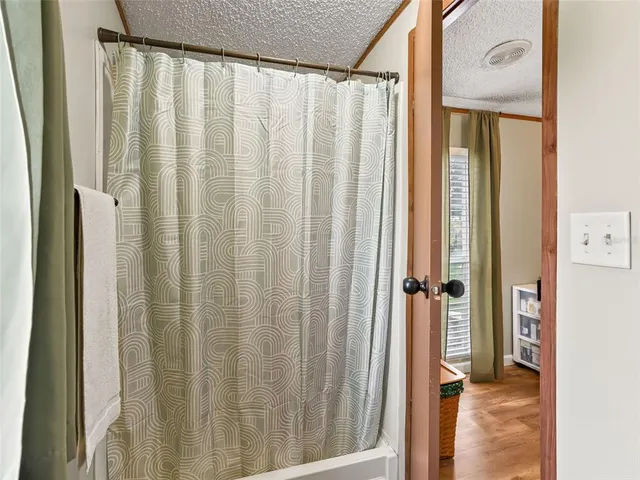 a view of a bathroom from a hallway