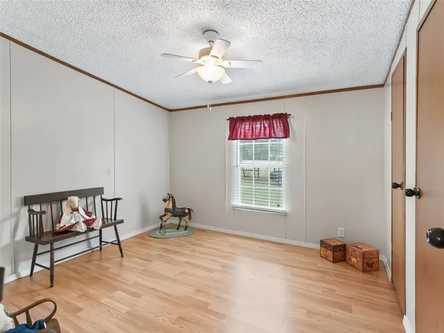 a workspace with furniture window and wooden floor