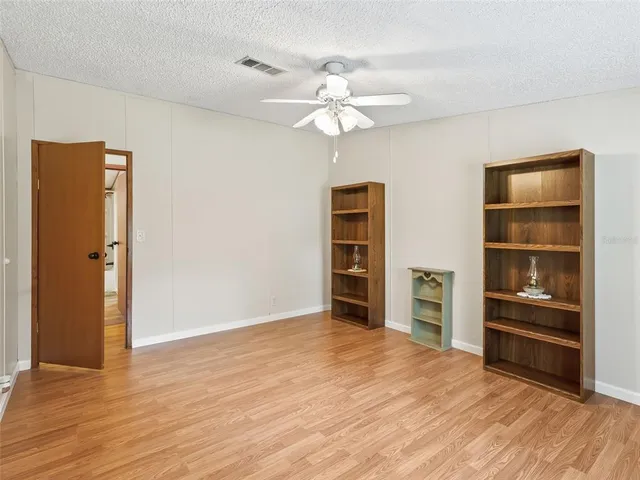 a view of a bedroom with closet and cabinet