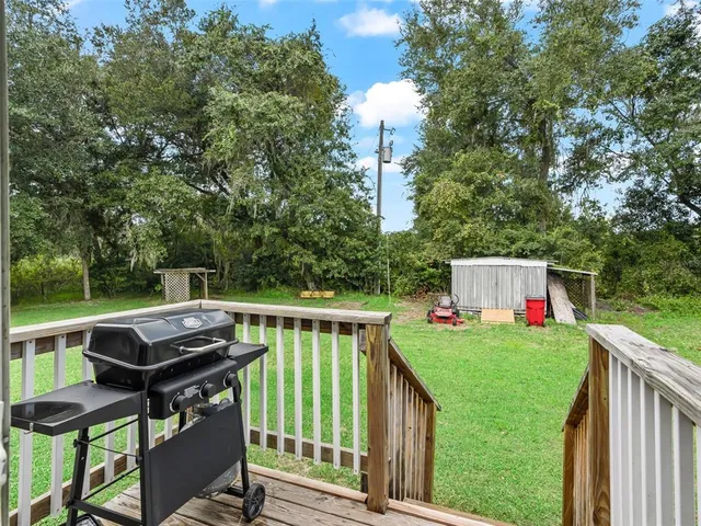 a view of a chairs and table on the deck