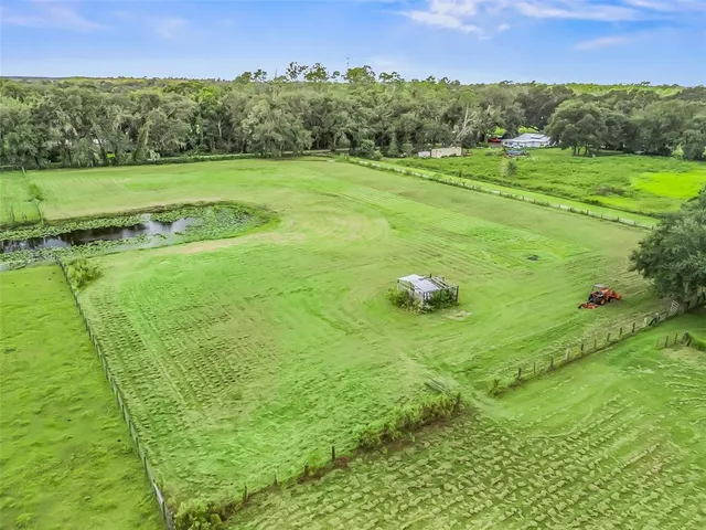 a backyard of a house with lots of green space