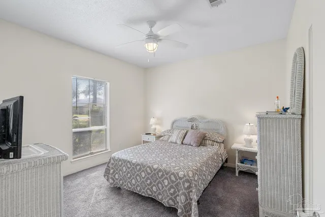 a view of house with swimming pool outdoor seating