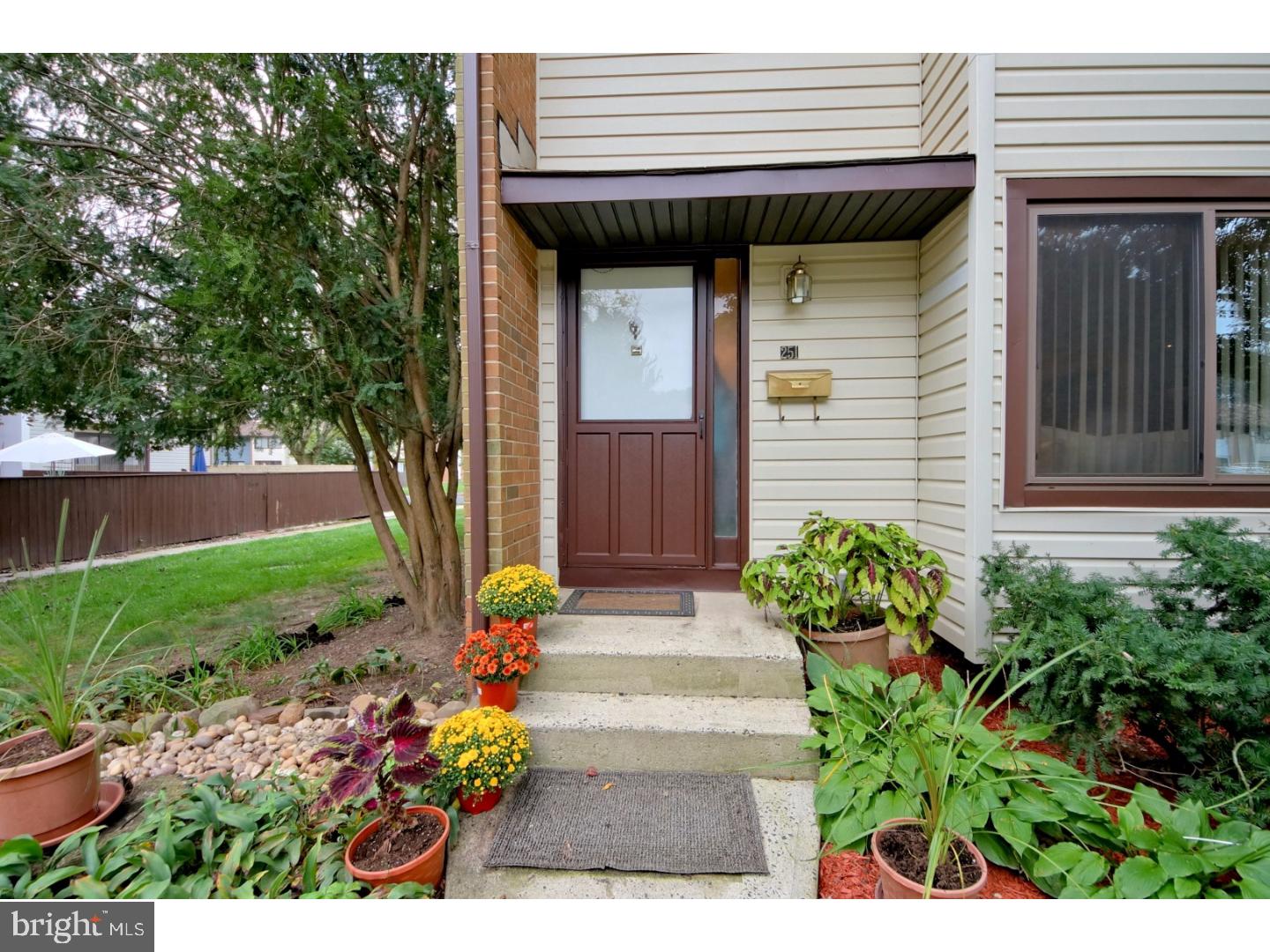 251 Probasco Road East Windsor, NJ 08520 - Photo 2 of 25 a front view of a house with a garden