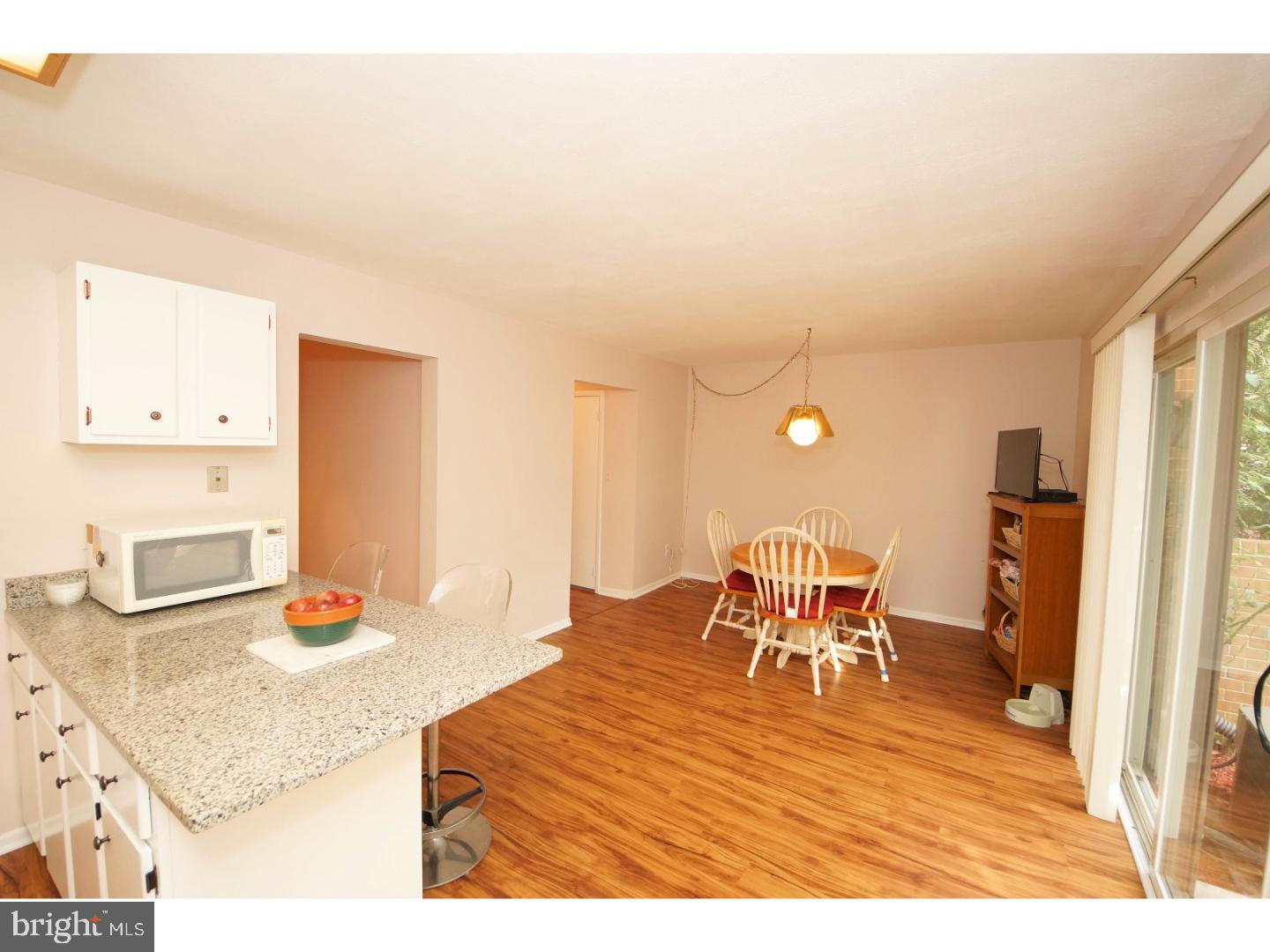 251 Probasco Road East Windsor, NJ 08520 - Photo 11 of 25 a view of a dining room with furniture and wooden floor