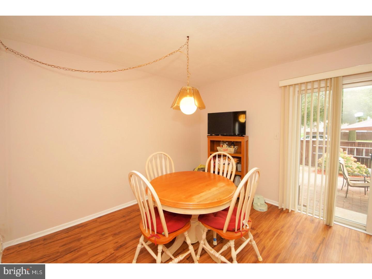 251 Probasco Road East Windsor, NJ 08520 - Photo 12 of 25 a view of a dining room with furniture and wooden floor