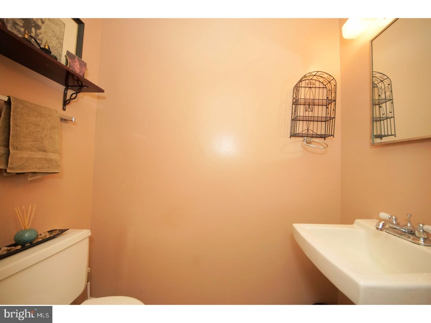 251 Probasco Road East Windsor, NJ 08520 - Photo 14 of 25 a bathroom with a sink a vanity and a mirror