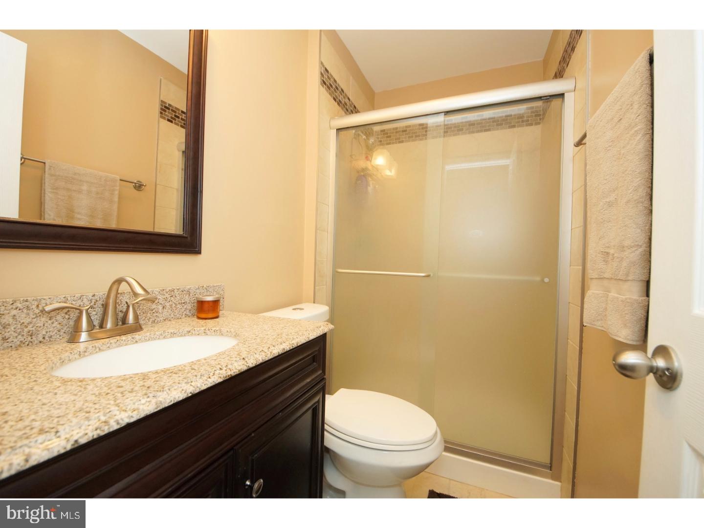 251 Probasco Road East Windsor, NJ 08520 - Photo 16 of 25 a bathroom with a granite countertop sink toilet and shower