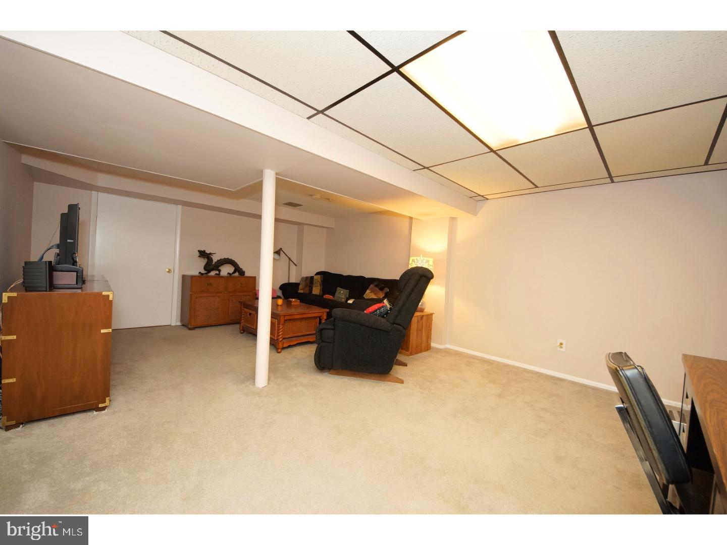 251 Probasco Road East Windsor, NJ 08520 - Photo 20 of 25 a bed room with furniture and a flat screen tv