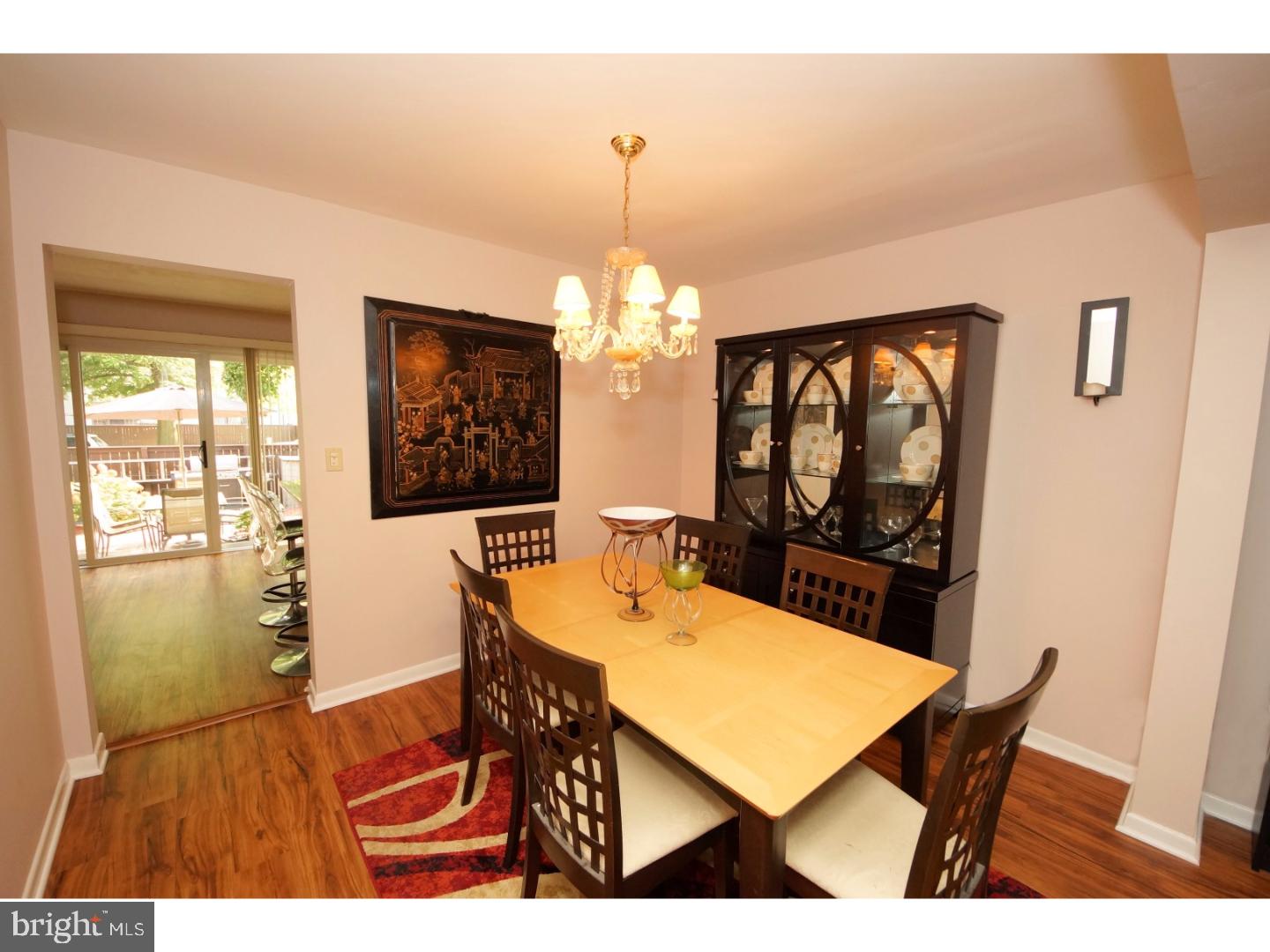 251 Probasco Road East Windsor, NJ 08520 - Photo 6 of 25 a view of a dining room with furniture and a chandelier