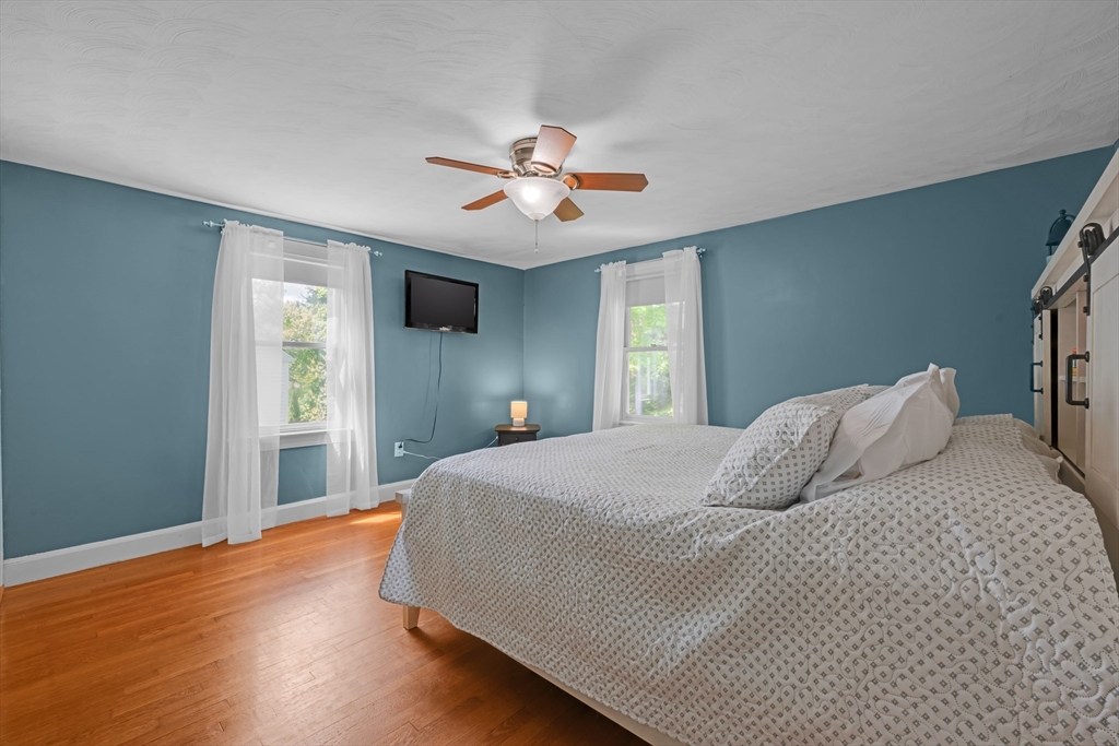 71 Morningside Road Worcester, MA 01602 - Photo 20 of 42 a bedroom with a large bed and a chandelier