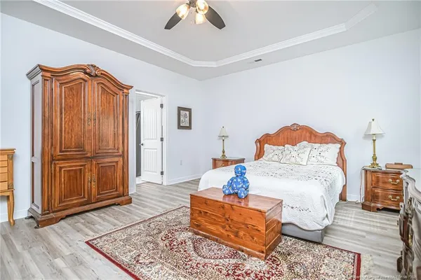 a bedroom with furniture and a rug