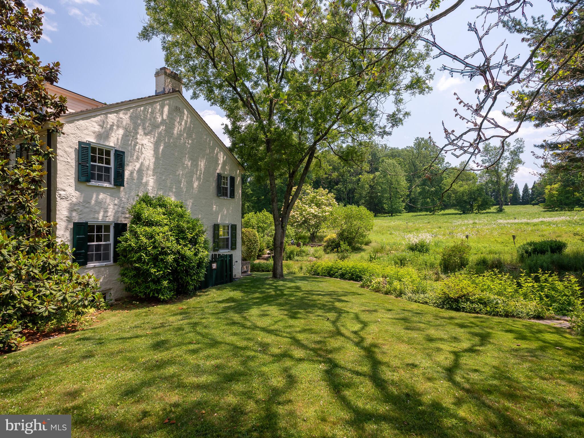 9 Marlborough Road Newtown Square, PA 19073 - Photo 60 of 83 Side Facade with Lawn & Meadow View