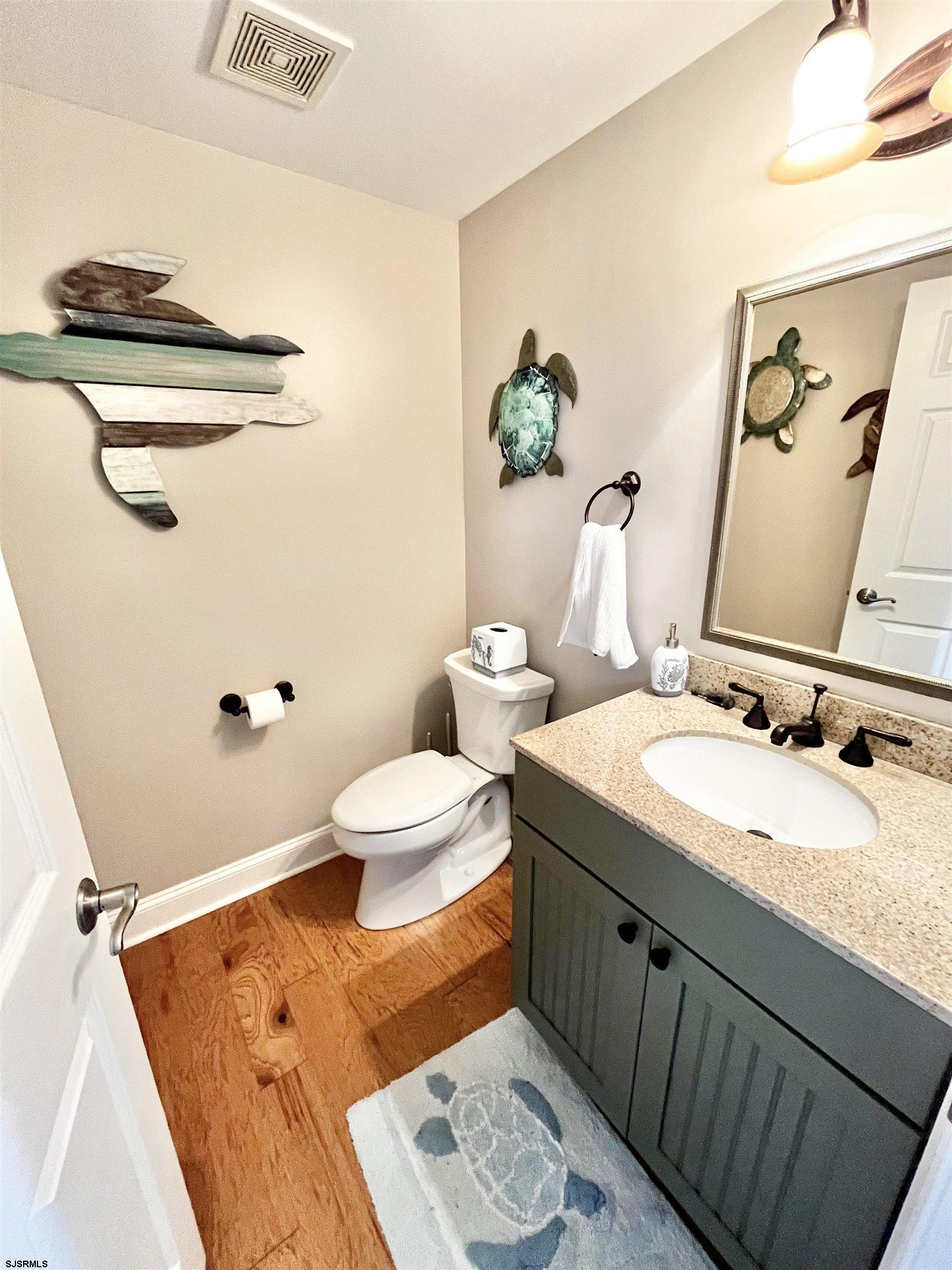38 Walnut Road Ocean City, NJ 08226 - Photo 13 of 37 a bathroom with a granite countertop sink mirror vanity and toilet