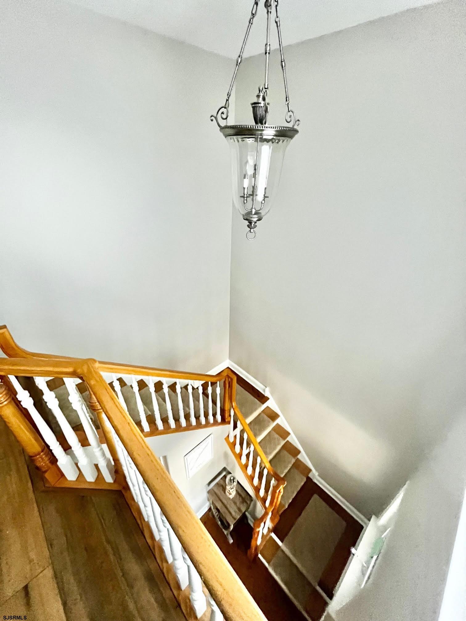 38 Walnut Road Ocean City, NJ 08226 - Photo 16 of 37 a view of a room with racks and a chandelier