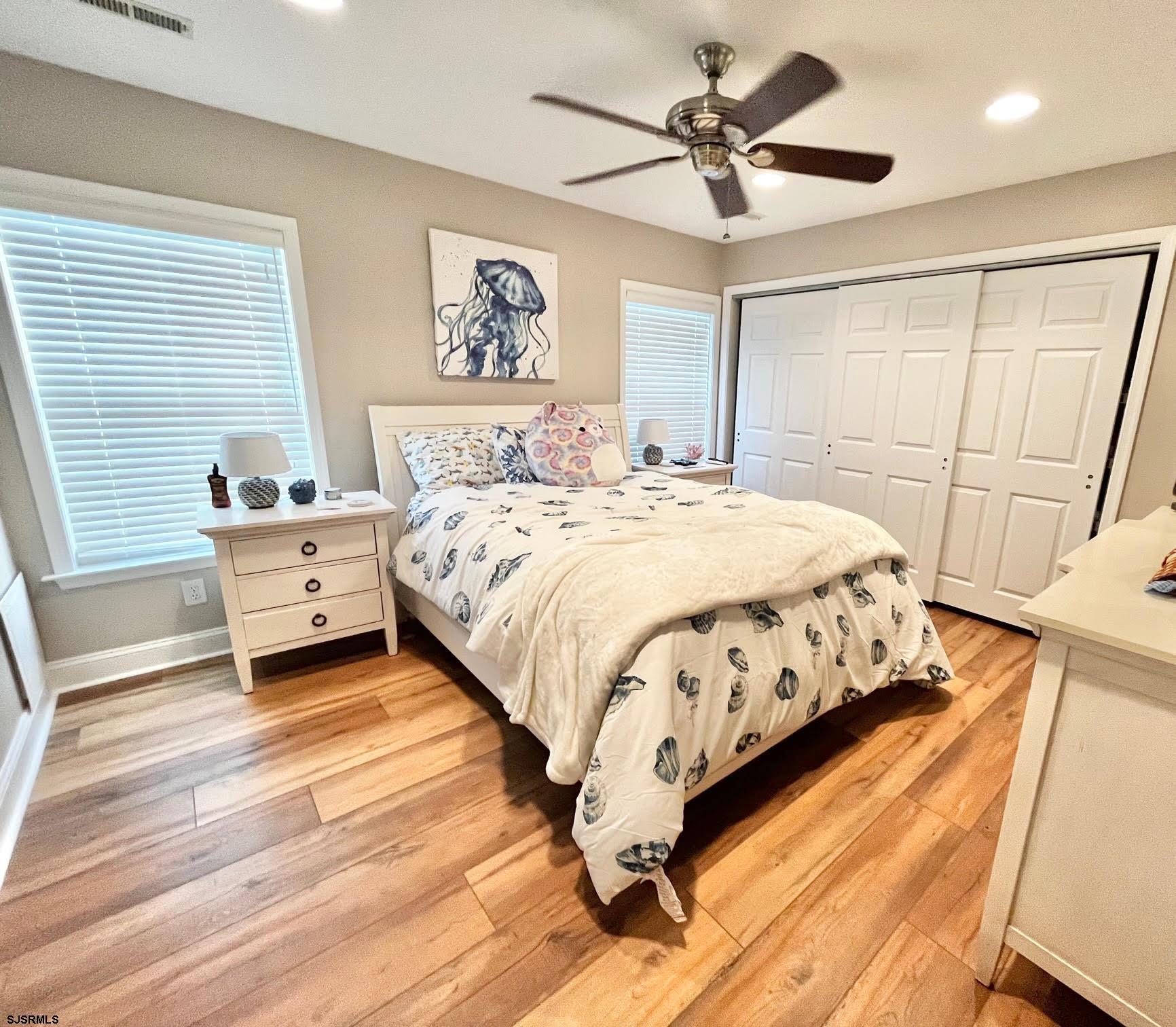 38 Walnut Road Ocean City, NJ 08226 - Photo 27 of 37 a bedroom with a bed and a chandelier