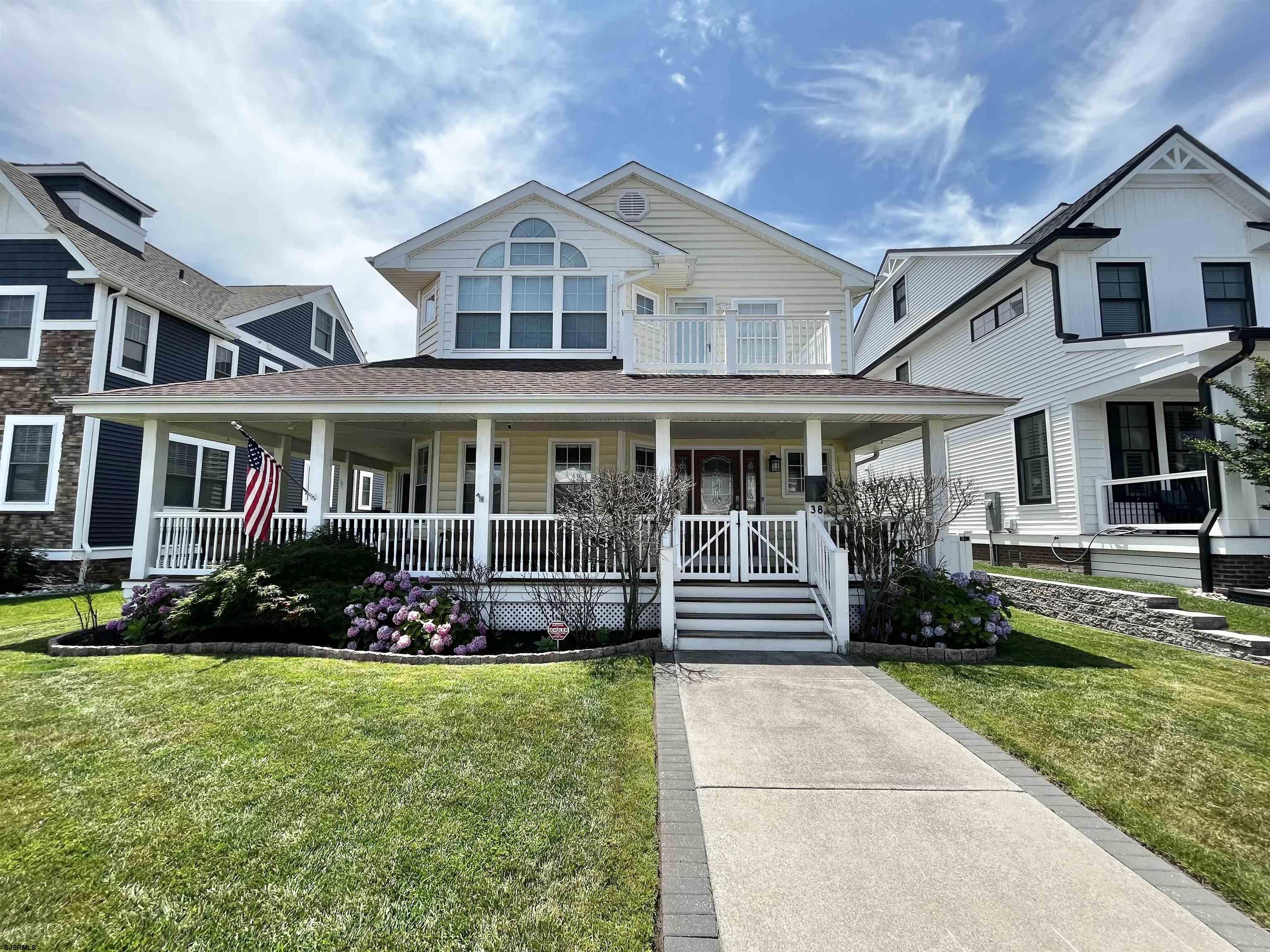 38 Walnut Road Ocean City, NJ 08226 - Photo 35 of 37 a front view of a house with a yard table and chairs