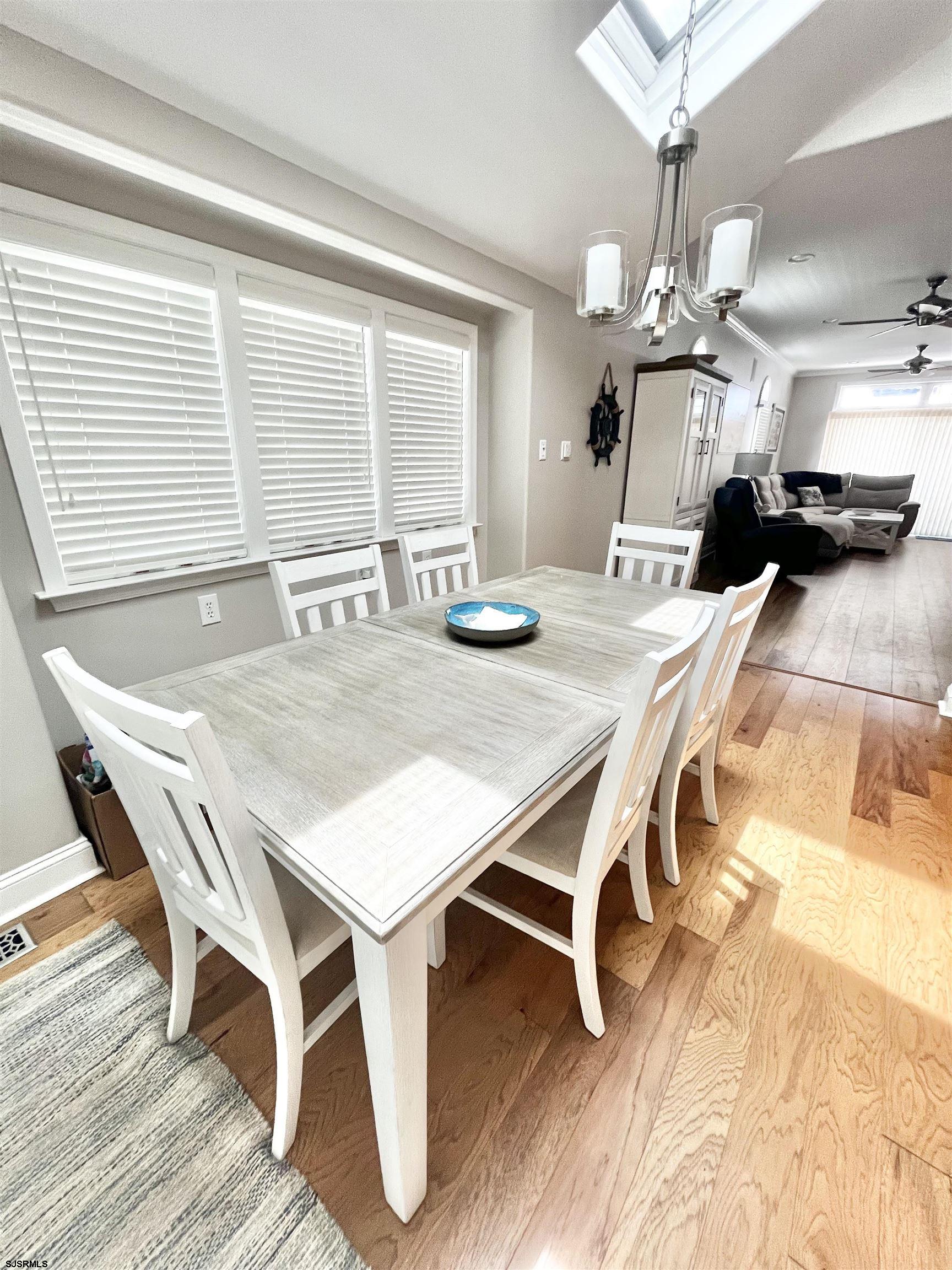 38 Walnut Road Ocean City, NJ 08226 - Photo 8 of 37 a view of a dining room with furniture and a chandelier
