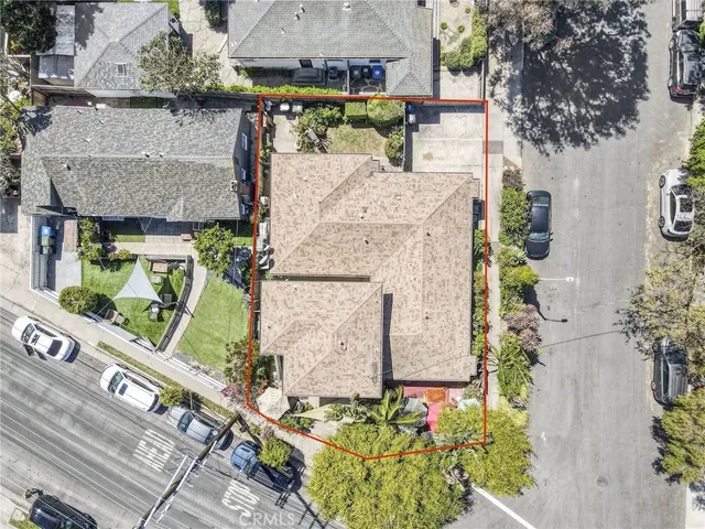 an aerial view of residential houses with outdoor space