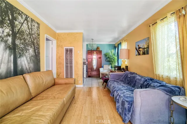 a living room with a couch and a window