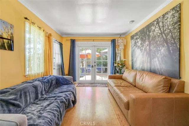 a living room with a couch and a large window