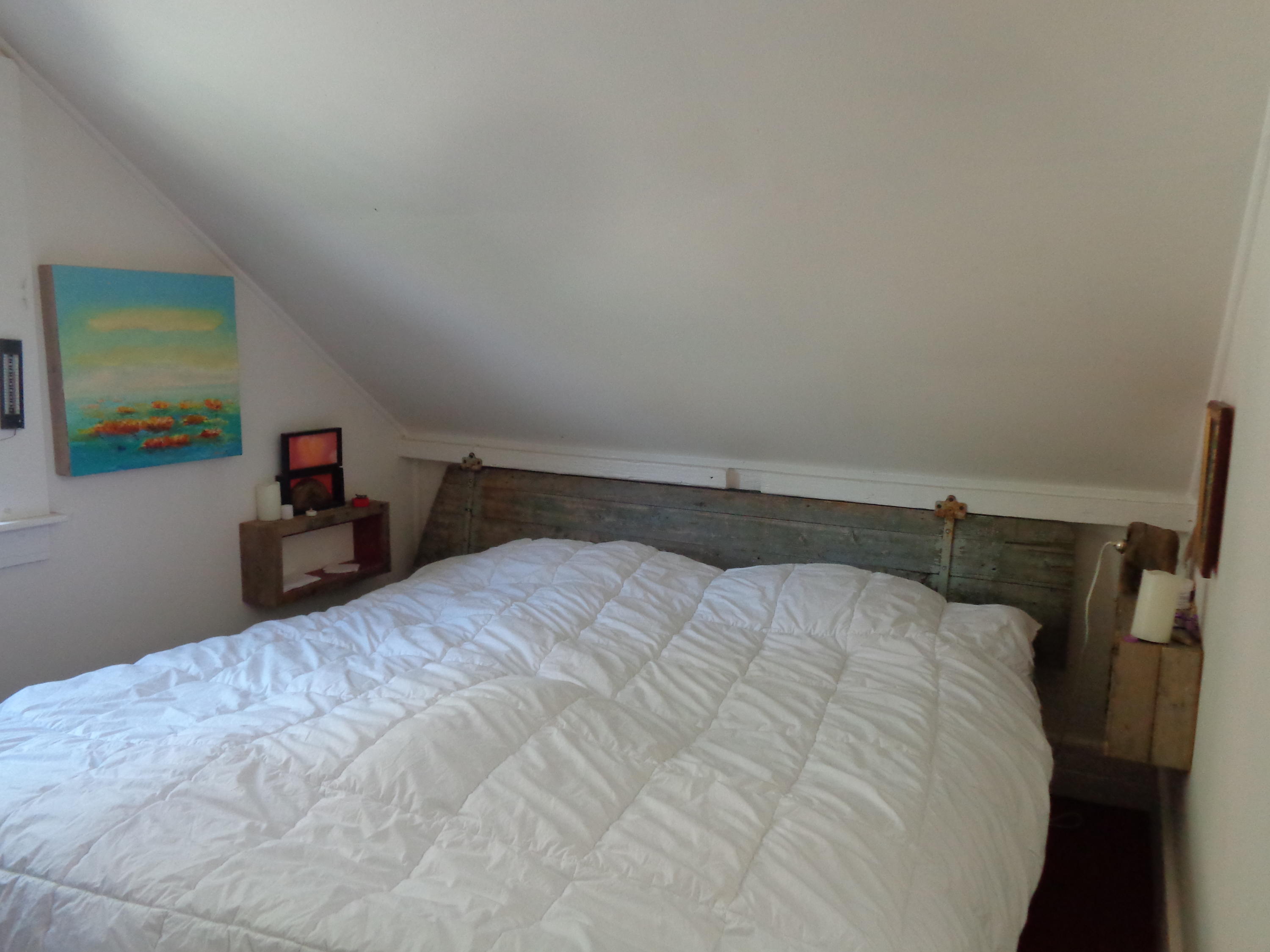 6 Holsbery Road Truro, MA 02666 - Photo 17 of 33 a bedroom with a bed and a desk