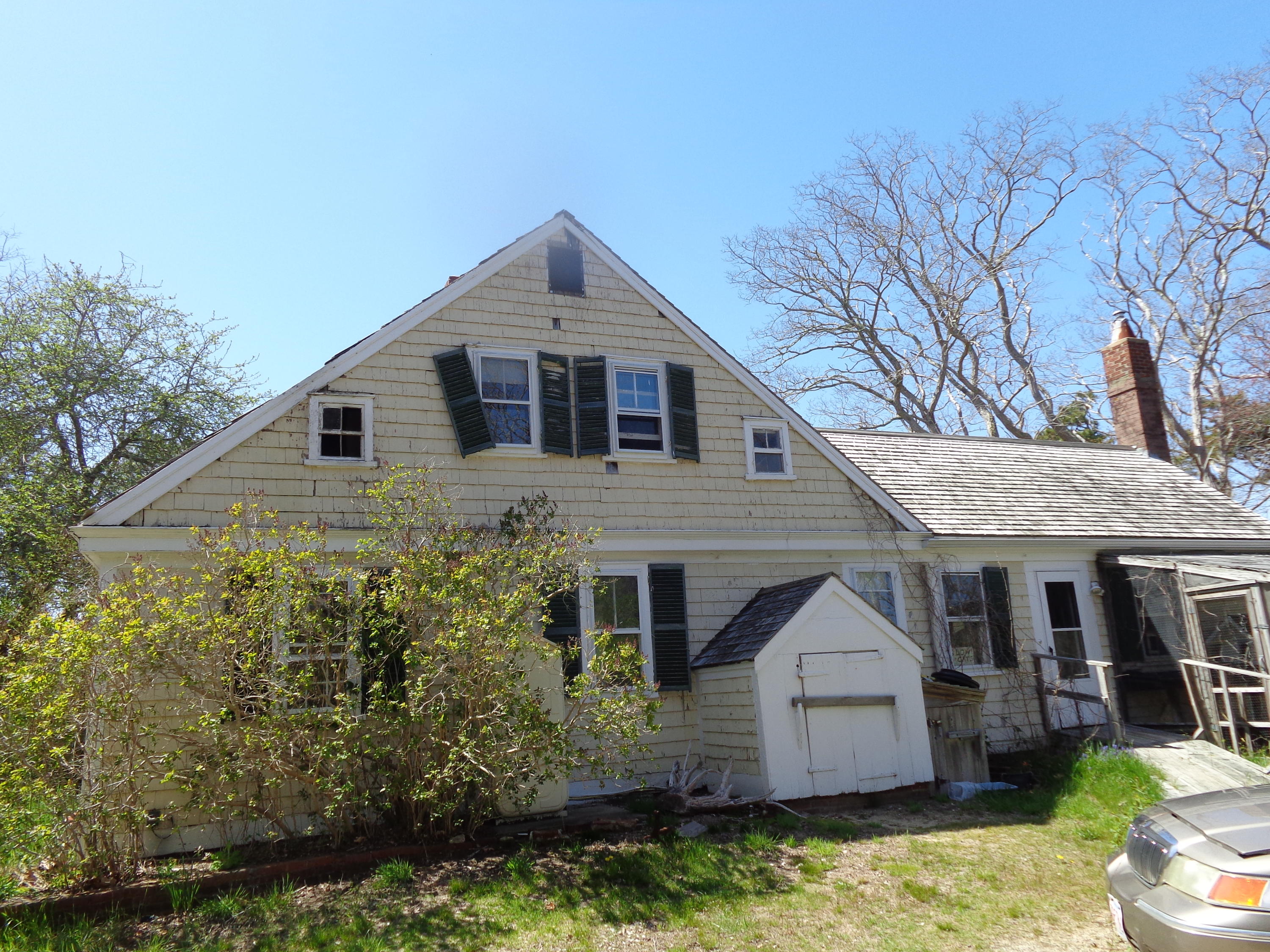 6 Holsbery Road Truro, MA 02666 - Photo 3 of 33 a front view of a house with a yard