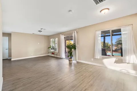 a view of livingroom with hardwood floor and a window