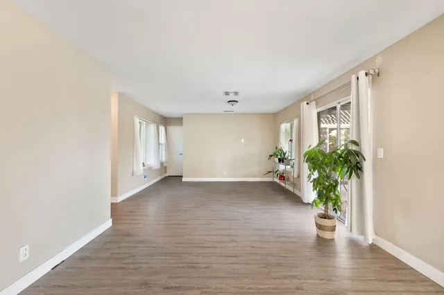 a view of a furniture and wooden floor in a room