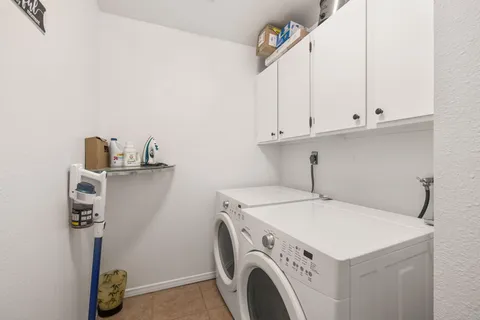 a sitting area with furniture and wooden floor