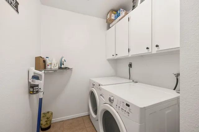 a sitting area with furniture and wooden floor