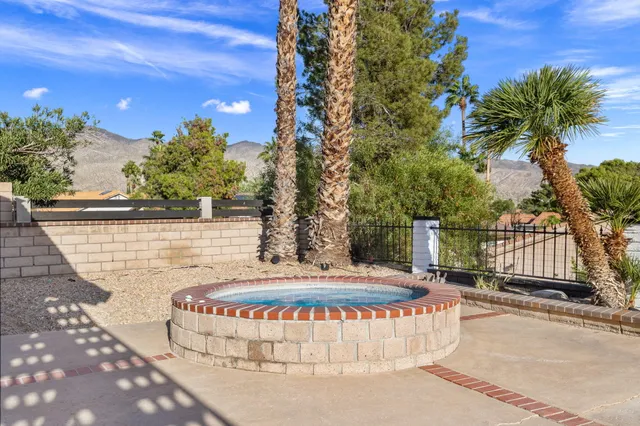 a view of a swimming pool with a patio