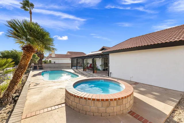 a view of a swimming pool with a patio