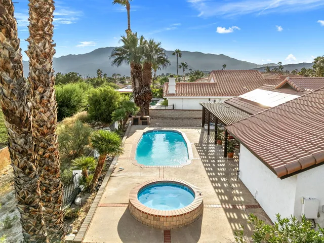 an aerial view of residential building and lake
