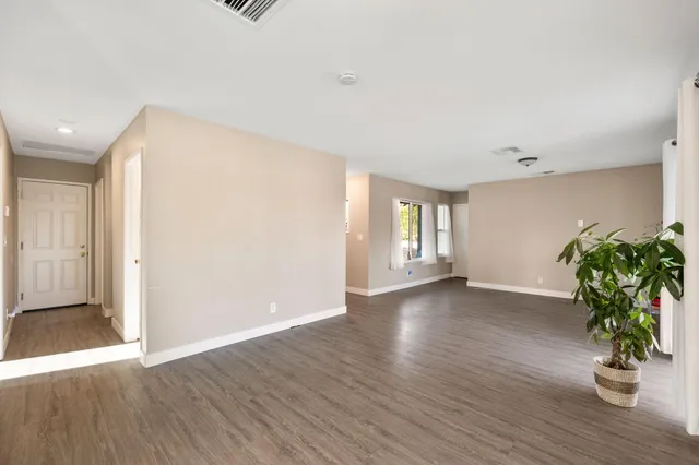 a view of an entryway with wooden floor