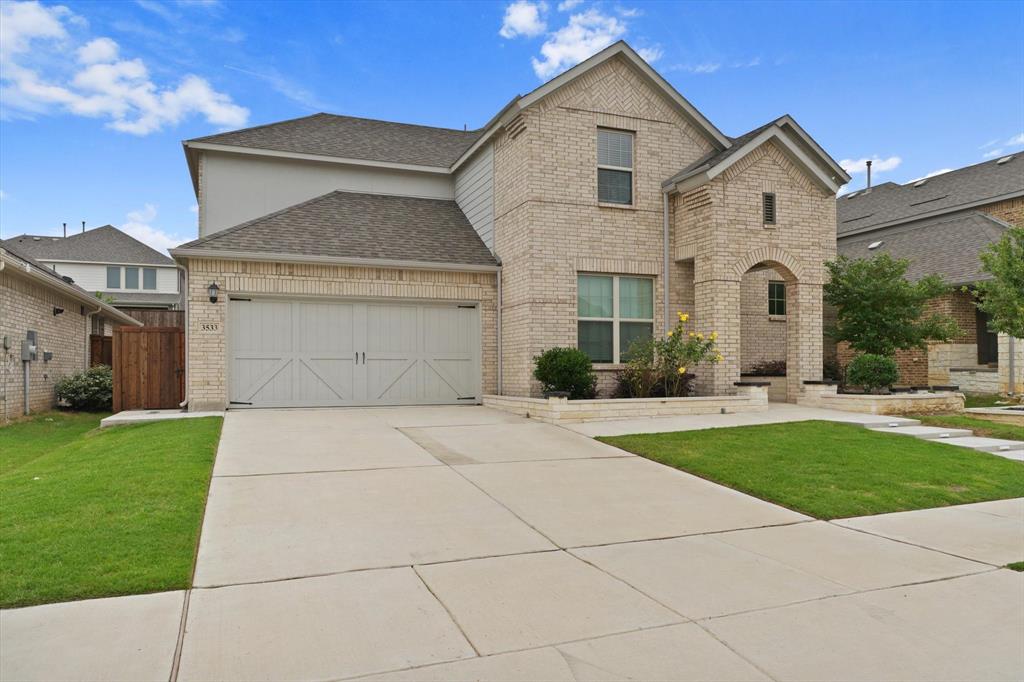 3533 Hyacinth Way Prosper, TX 75078 - Photo 3 of 38 a front view of a house with garden