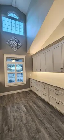 a view of a room with furniture and window