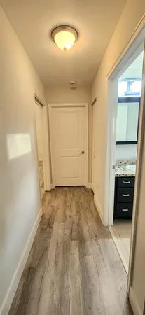 wooden floor in an empty room and a window