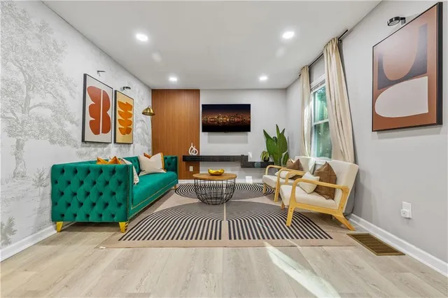 a living room with furniture and a flat screen tv