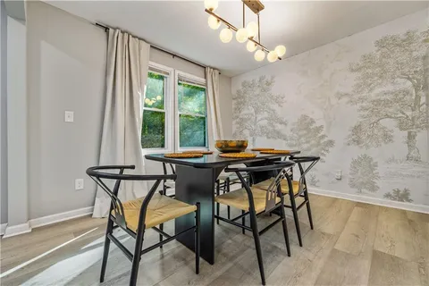 a view of a dining room with furniture and window