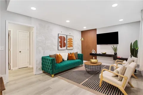 a kitchen with granite countertop a refrigerator and a stove top oven