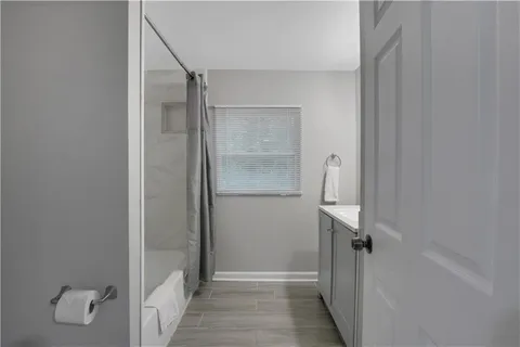 a view of entryway and hall with wooden floor