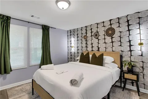 a large white bed in a white room