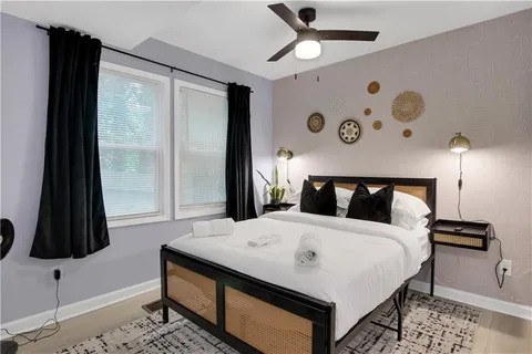 a living room with furniture and a rug