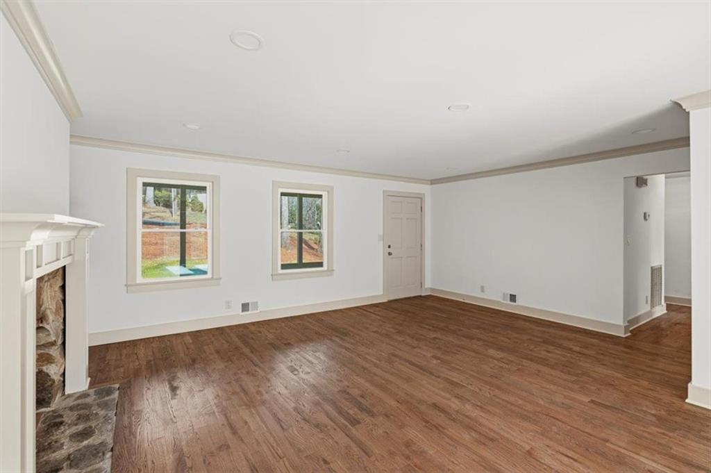 49 Apache Trail Cartersville, GA 30120 - Photo 12 of 52 an empty room with wooden floor and windows