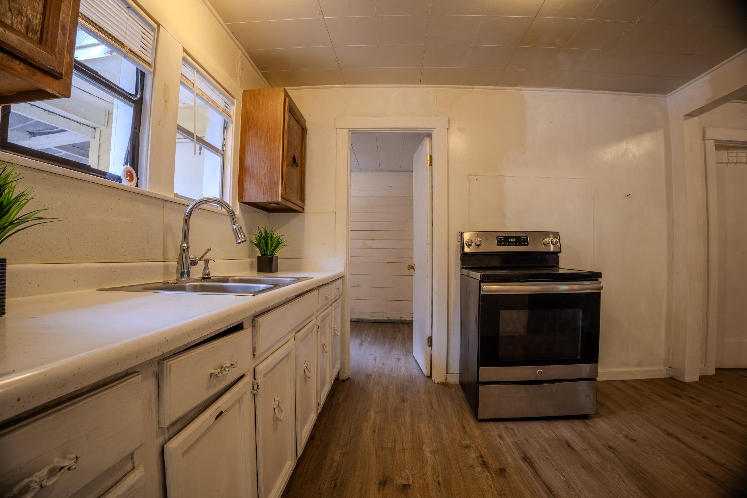 2896 Clay Street Placerville, CA 95667 - Photo 13 of 38 a kitchen with stainless steel appliances and wooden cabinets