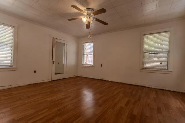 a view of a bathroom with wooden floor