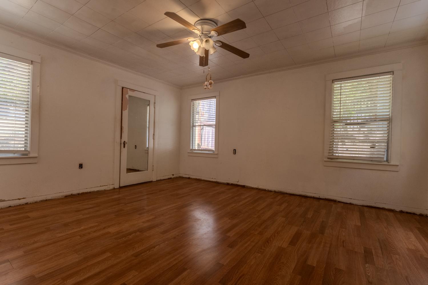 2896 Clay Street Placerville, CA 95667 - Photo 17 of 38 a view of an empty room with window and wooden floor